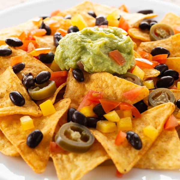 El Castillo Mexicano nachos with guacamole, black beans, diced tomatoes, yellow peppers, and jalapeños.